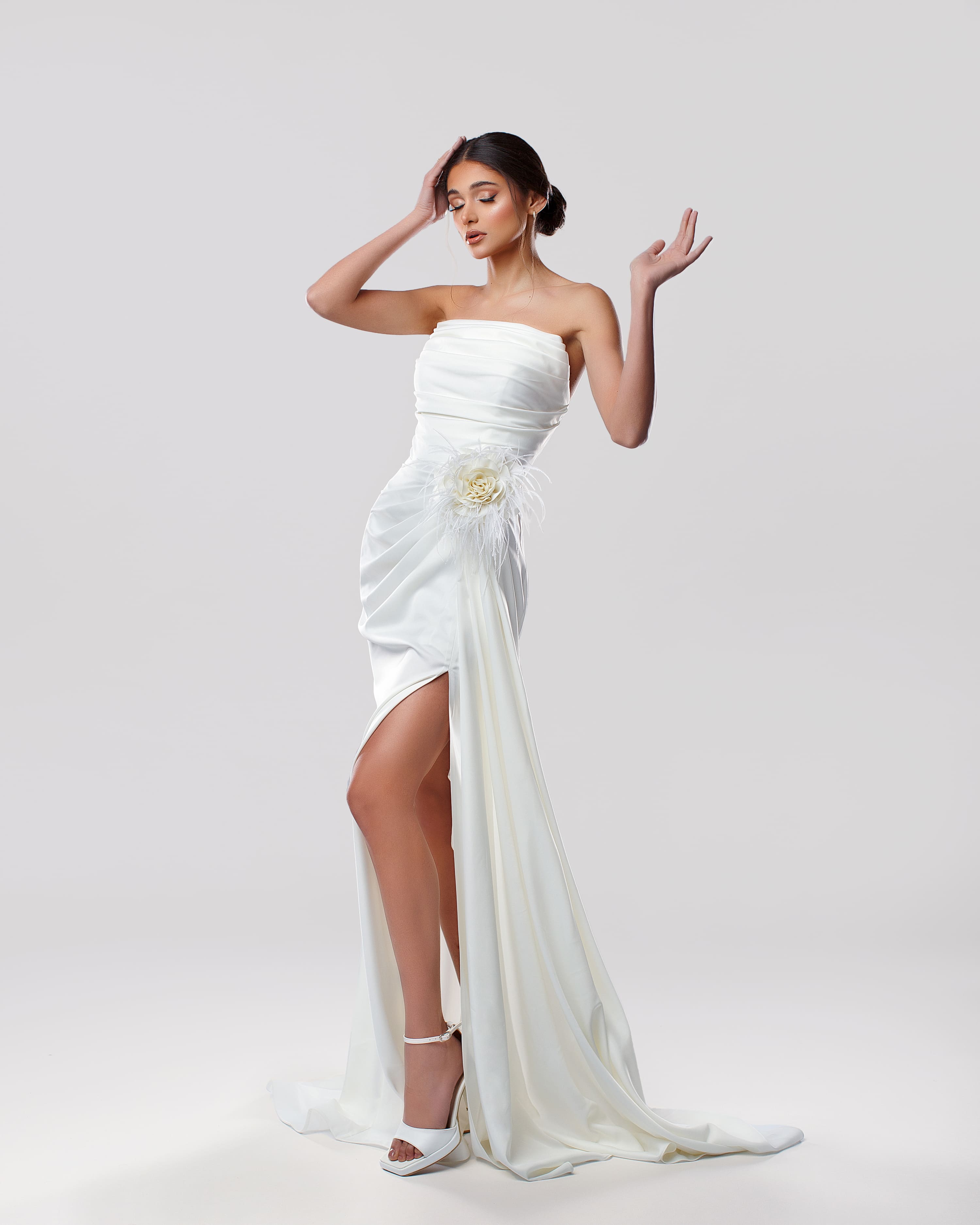 Strapless white bridal long dress with draping and feather flower - Front movement view